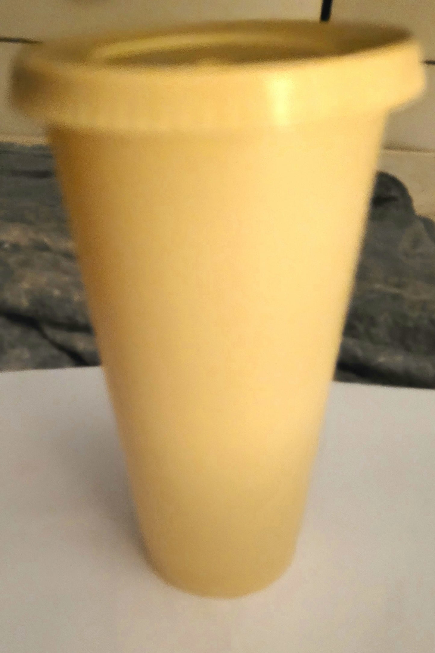 Yellow plastic cup